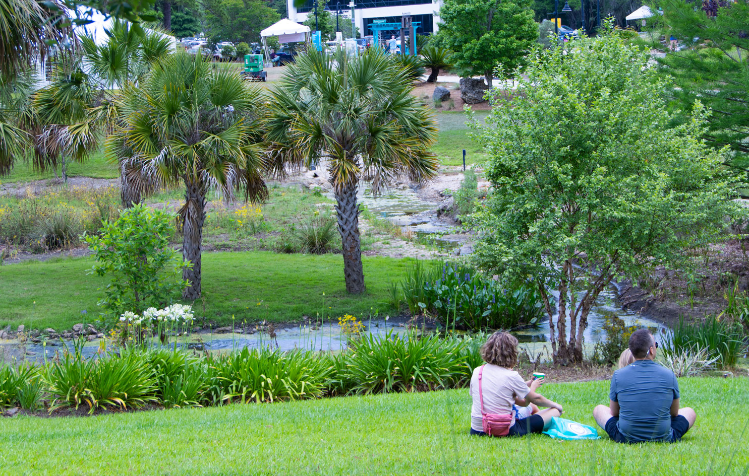 two people citting near water